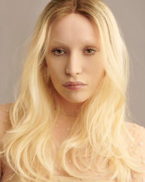 Platinum blonde Provenir topper with long soft waves on model