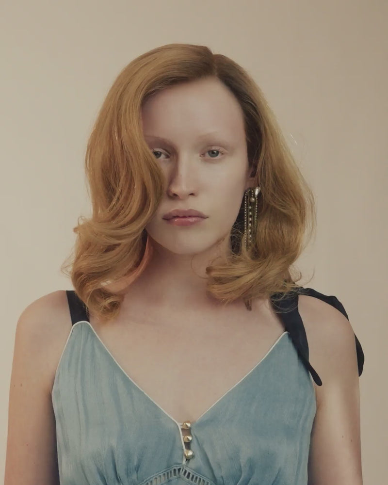 Video showing Provenir 6R light red hairpiece styled in soft shoulder-length waves