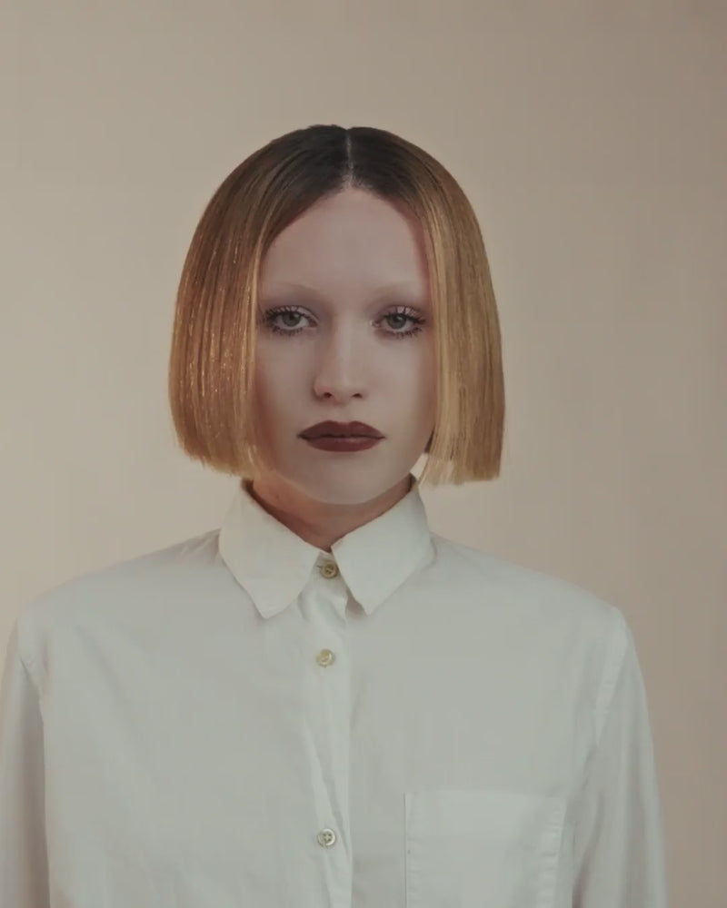 Video showing Provenir 8N dark blonde hairpiece styled in a sleek blunt bob
