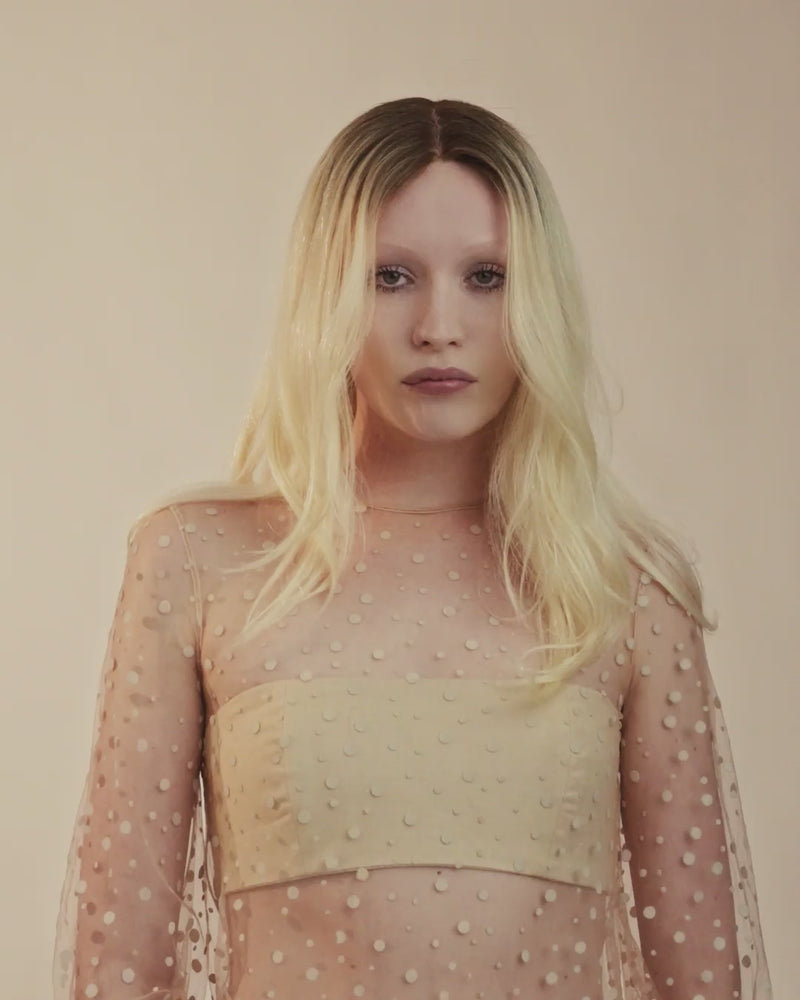 Video of platinum blonde Provenir topper with long soft waves on model